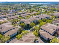 An aerial view showcases the community's lush greenery and well-maintained buildings at 8276 Maritime Flag St # 110, Windermere, FL 34786