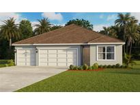 Charming single-story home with a three-car garage and well-manicured lawn at 1507 Fountain View St, Ormond Beach, FL 32174