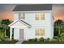 Charming two-story home with a welcoming front porch and lush landscaping at 1959 Branched Oak Rd, St Cloud, FL 34771