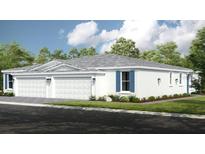 Charming single-story home with white exterior, blue shutters, and a well-manicured lawn at 5352 Spoonflower Ct, St Cloud, FL 34771