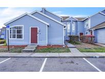 Charming townhouse featuring a light blue exterior with well-maintained landscaping at 758 Orchid Dr, Davenport, FL 33897