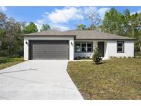Charming single-story home featuring a two-car garage and newly landscaped front yard at 4470 Frances Ave, Sanford, FL 32773