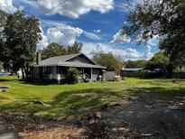 Charming single-Gathering home with a front porch, chimney, and large front yard at 914 2Nd St, Orlando, FL 32824