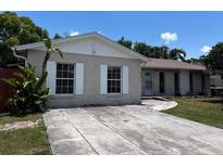 Charming single-story home featuring a spacious driveway and well-maintained front yard at 131 San Blas Ave, Kissimmee, FL 34743