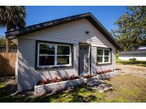 Charming home featuring fresh exterior paint, a well-manicured lawn, and beautiful curb appeal at 4452 Fairview Ave, Orlando, FL 32804