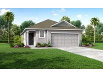 Charming one-story home with well-manicured lawn and attached two-car garage at 3864 Bluethread Way, Poinciana, FL 34759