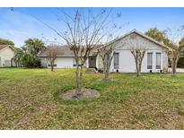 Charming single-story home featuring a well-maintained lawn and mature trees in a quiet neighborhood at 1022 Antelope Trl, Winter Springs, FL 32708