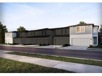 Charming townhomes feature neutral paint, attached garages, and well-maintained landscaping at 4353 Switchgrass Ln, St Cloud, FL 34772