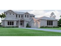Stately two-story home featuring a metal roof, front-facing three-car garage, and neatly manicured landscaping at 4654 Thornlea Rd, Orlando, FL 32817