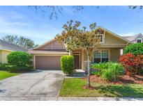 Charming single-Gathering home with a well-maintained lawn, mature landscaping, and a two-car garage at 12824 Penshurst Ln, Windermere, FL 34786