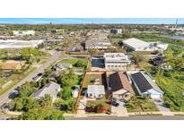 An aerial view shows the property's lot and surrounding neighborhood at 859 Neuse Ave, Orlando, FL 32804