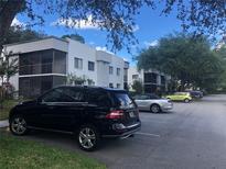 Apartment complex featuring on-site parking and exterior facade at 2597 Oak Park Way # 205, Orlando, FL 32822