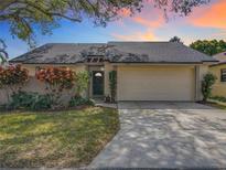 Charming single-story home with a well-maintained lawn and a two-car garage, offering curb appeal at 734 Adidas Rd, Winter Springs, FL 32708