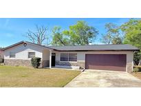 Charming single-story home with a well-maintained lawn and attached two-car garage at 1420 Continental Dr, Daytona Beach, FL 32117