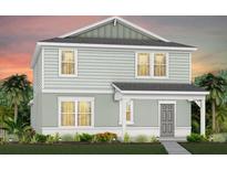 Charming two-story home with light green siding and a welcoming front porch at 1977 Branched Oak Rd, St Cloud, FL 34771