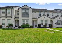 Charming townhome with well-maintained lawn and neutral-colored exterior at 394 Captiva Dr, Davenport, FL 33896
