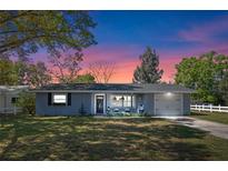 Charming single-story home with a well-manicured lawn and inviting front porch, perfect for relaxing evenings at 1815 6Th Se St, Winter Haven, FL 33880