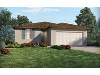 Charming single-story home featuring a two-car garage, well-maintained landscaping, and a welcoming front entrance at 3872 Giorgio Dr, Winter Haven, FL 33884