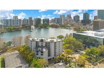 Stunning aerial view of the building and its downtown Orlando lakefront setting at 401 E Robinson St # 202, Orlando, FL 32801