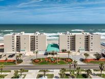 Oceanfront condominium buildings with well-manicured landscaping and beautiful beach access at 4495 S Atlantic Ave # 5020, Ponce Inlet, FL 32127