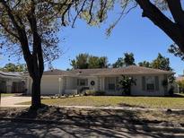 Charming single-story home with a well-manicured lawn and inviting curb appeal at 5224 Andrea Blvd, Orlando, FL 32807