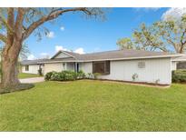 Charming single-story home with well-manicured lawn and mature trees in a peaceful neighborhood at 4029 Cool Water Ct, Winter Park, FL 32792