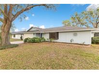 Charming single-story home with a well-maintained lawn and mature trees in a quiet residential neighborhood at 4029 Cool Water Ct, Winter Park, FL 32792