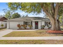 Charming single-story home with a well-maintained front yard and inviting curb appeal at 6872 Compass Ct, Orlando, FL 32810