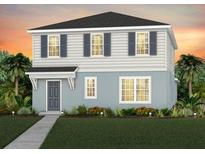 Two-story home with gray siding, blue trim, and black shutters set against a beautiful sunset sky at 7062 Rosy Sky Ave, Orlando, FL 32829