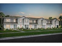 New construction townhomes feature neutral siding and landscaping at 10274 Hadley St, Orlando, FL 32829