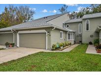 Charming townhome features attached garage, well-maintained lawn, and inviting curb appeal at 35 Misners Trl, Ormond Beach, FL 32174