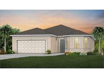 Charming single-story home with a two-car garage, manicured lawn, and meticulously landscaped front yard at 1875 Groveline Rd, St Cloud, FL 34771