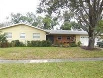Charming single-story home with a well-maintained lawn and mature landscaping at 1511 Leeway Ave, Orlando, FL 32810