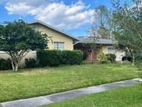 Charming single-story home with mature landscaping and a well-manicured lawn at 1511 Leeway Ave, Orlando, FL 32810
