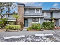 Charming townhouse with well-maintained landscaping and brick architectural details at 713 Saint Matthew Cir, Altamonte Springs, FL 32714