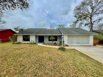 Charming single-story home featuring a well-maintained yard and a two-car garage at 924 Mill Road Ln, Port Orange, FL 32127
