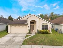 Charming single-story home with well-maintained lawn, attached garage and welcoming front entrance at 958 High Point Loop, Longwood, FL 32750