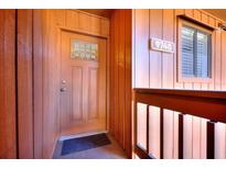 A close-up of the front door with a decorative glass insert and unit number at 974 E Michigan St # 974, Orlando, FL 32806
