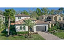 Beautiful home with a tile roof, manicured landscaping, and attached two-car garage at 1377 Tappie Toorie Cir, Lake Mary, FL 32746