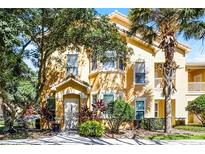 Charming two-story home with lush landscaping and a welcoming entrance at 19914 Villa Creek Dr # 105, Orlando, FL 32821