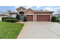 Charming single-Gathering home with a well-manicured lawn and a spacious three-car garage at 2029 Majestic Elm Blvd, Ocoee, FL 34761