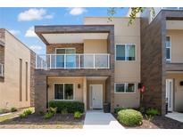 Beautiful modern two-story townhome with manicured landscaping and a balcony at 3191 Brasilia Ave, Kissimmee, FL 34747