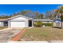 Charming single-story home with a well-manicured lawn and inviting curb appeal at 3708 Pipes O The Glen Way, Orlando, FL 32808