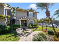 Charming townhouse with well-maintained landscaping, and inviting entrance at 6050 Scotchwood Gln # Ge, Orlando, FL 32822