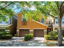 Charming two-story home featuring an attached two-car garage and well-maintained landscaping at 9236 Sweet Maple Ave, Orlando, FL 32832