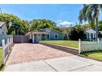 Charming home with beautiful brick driveway, manicured lawn, and lush landscaping at 5108 Sunrise Blvd, Orlando, FL 32803
