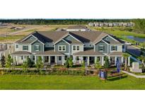 New townhomes with well manicured lawns and landscaping, walking paths and large pond at 13809 Luna Harvest Ave, Winter Garden, FL 34787