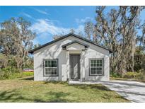 Charming single story home with a well-manicured lawn and a private driveway at 179 Douglas Ave, Chuluota, FL 32766