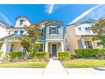 Charming two-story home with lush landscaping and a welcoming front entrance at 5156 Caspian St, St Cloud, FL 34771