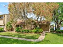 Charming single-story brick home with mature landscaping and a beautiful flowering tree at 409 Oak Haven Dr # 409, Altamonte Springs, FL 32701